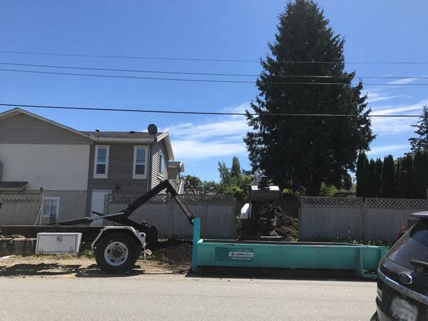 Hook-Lift System Truck with delivery a bin using the Hook-Lift system